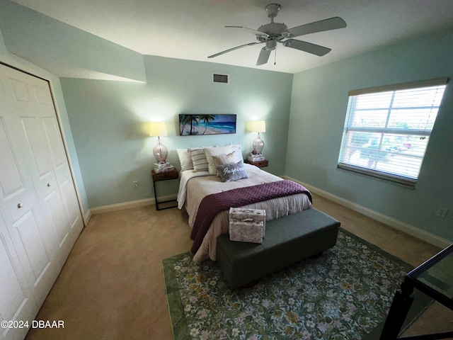 3145 S Atlantic Ave Unit 401, Daytona Beach, FL 32118 - carpeted bedroom featuring ceiling fan and a closet