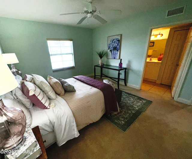 3145 S Atlantic Ave Unit 401, Daytona Beach, FL 32118 - bedroom with ensuite bathroom, ceiling fan, and carpet