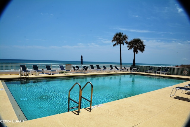 3145 S Atlantic Ave Unit 401, Daytona Beach, FL 32118 - view of pool with a water view and a patio area