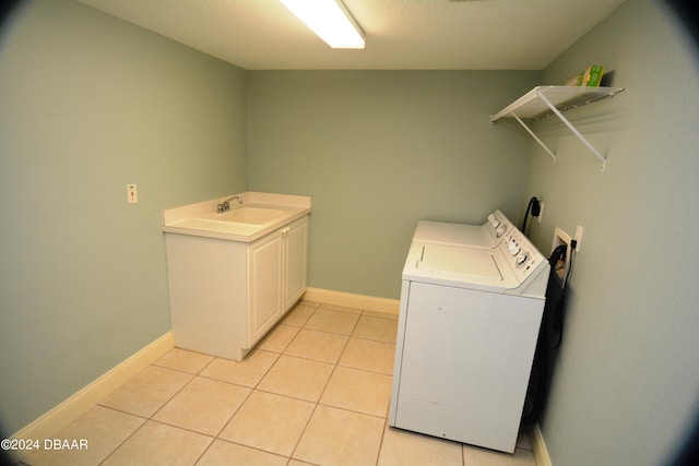 3145 S Atlantic Ave Unit 401, Daytona Beach, FL 32118 - washroom with cabinets, light tile patterned flooring, sink, and washer / clothes dryer
