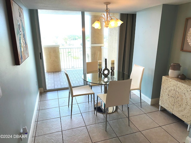 3145 S Atlantic Ave Unit 401, Daytona Beach, FL 32118 - dining space featuring light tile patterned floors and a notable chandelier