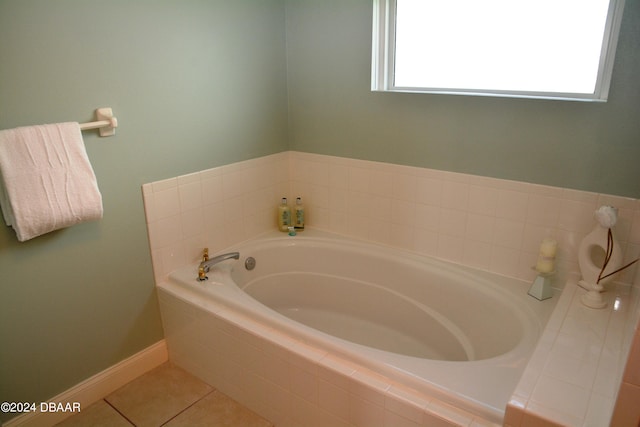 3145 S Atlantic Ave Unit 401, Daytona Beach, FL 32118 - bathroom with tiled bath and tile patterned flooring
