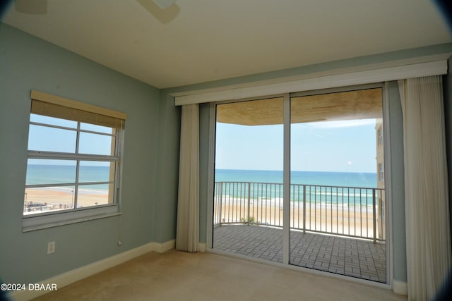 3145 S Atlantic Ave Unit 401, Daytona Beach, FL 32118 - carpeted spare room with a view of the beach and a water view