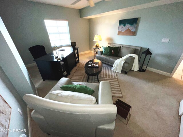 3145 S Atlantic Ave Unit 401, Daytona Beach, FL 32118 - living room with light colored carpet and ceiling fan