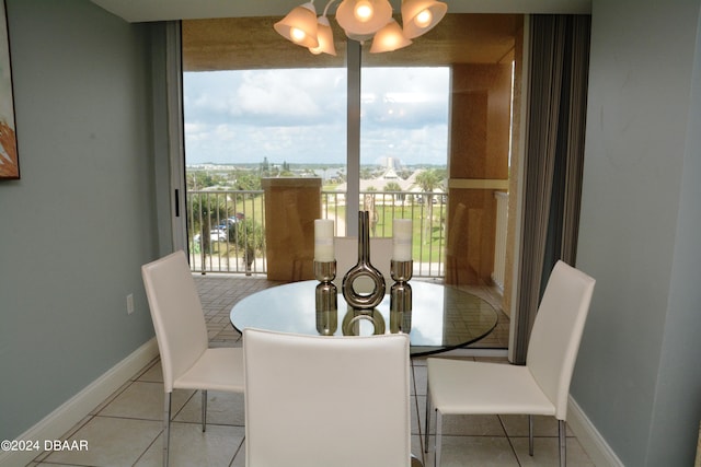 3145 S Atlantic Ave Unit 401, Daytona Beach, FL 32118 - tiled dining space with a chandelier