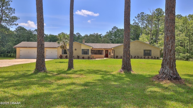 103 Cone Rd, Ormond Beach, FL 32174 - view of front of property with concrete driveway, an attached garage, and a front lawn