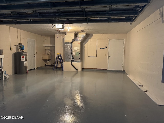 2421 Needle Palm Dr, Edgewater, FL 32141 - garage featuring water heater, heating unit, a sink, and concrete block wall