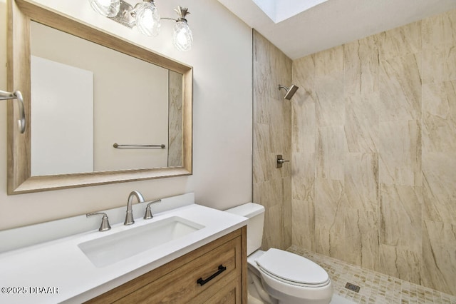 2421 Needle Palm Dr, Edgewater, FL 32141 - bathroom with toilet, a skylight, a tile shower, and vanity