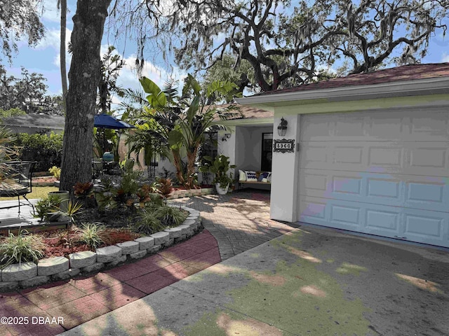 ranch-style house featuring a garage