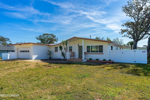 single story home with a garage and a front lawn