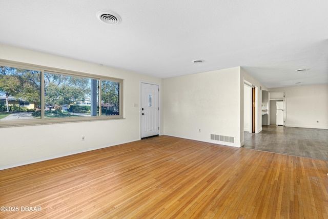 unfurnished living room with hardwood / wood-style floors