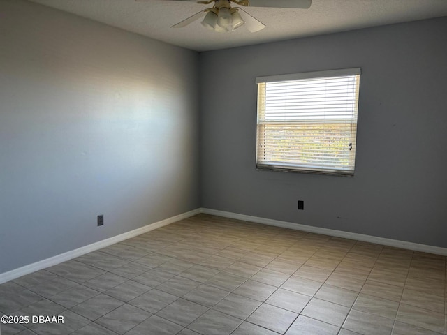 empty room featuring a textured ceiling and ceiling fan