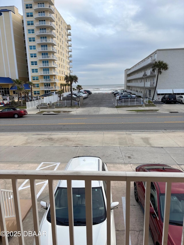 view of vehicle parking with a water view