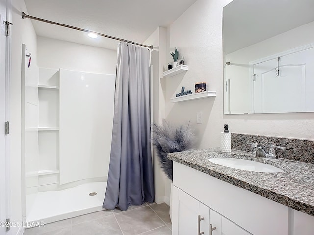 bathroom featuring tile patterned floors, curtained shower, and vanity