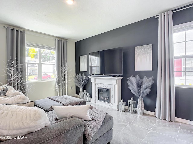 tiled living room with a premium fireplace