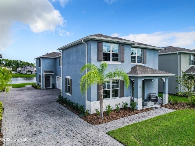 front of property featuring a water view