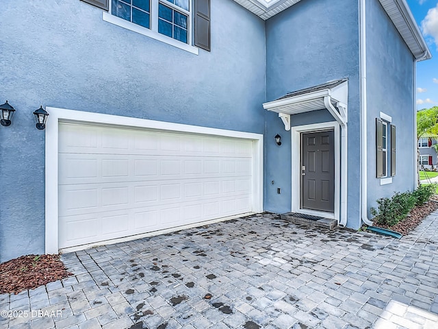 entrance to property featuring a garage