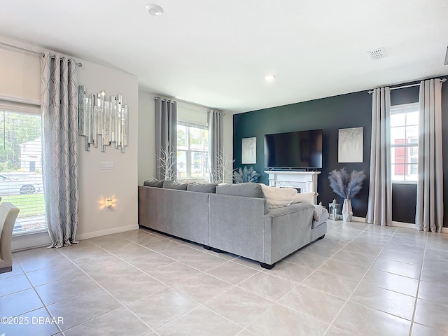 tiled living room featuring plenty of natural light