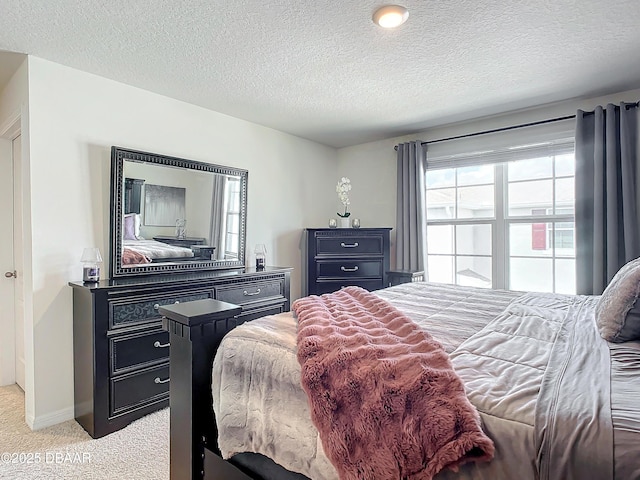 carpeted bedroom with a textured ceiling