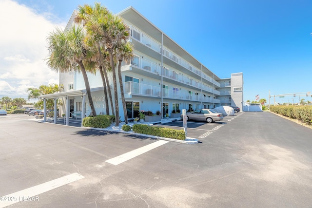 view of property with uncovered parking