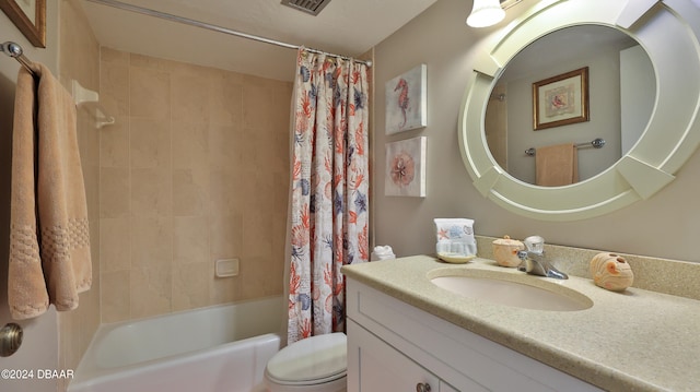 full bathroom with vanity, shower / bathtub combination with curtain, and toilet