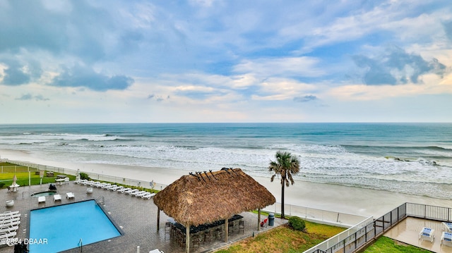 view of water feature featuring a view of the beach and a gazebo