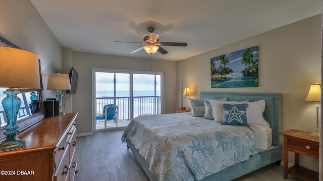 bedroom with hardwood / wood-style flooring, ceiling fan, and access to exterior