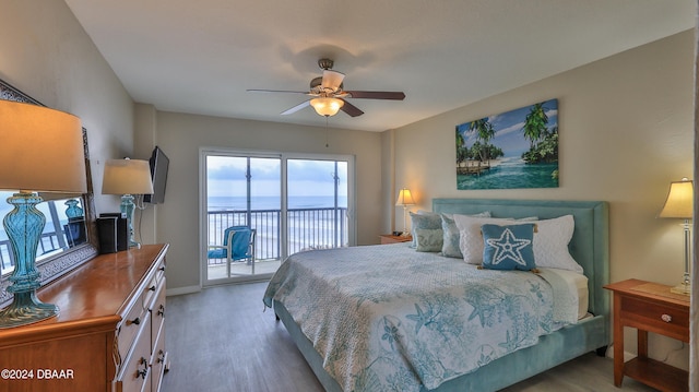 bedroom featuring access to exterior, light wood-type flooring, and ceiling fan