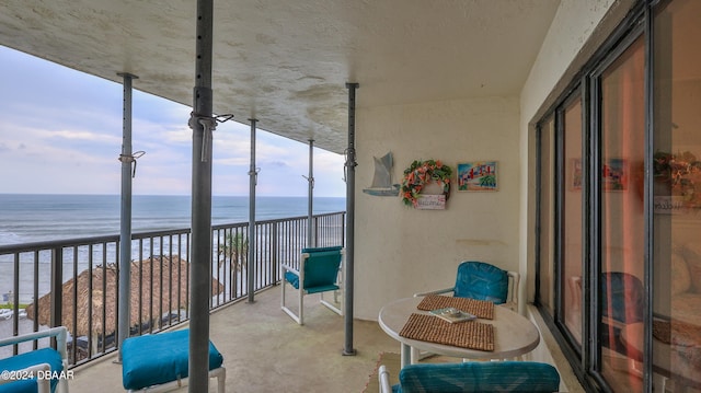 balcony featuring a water view