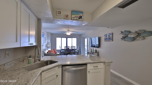 kitchen featuring sink, light hardwood / wood-style floors, white cabinets, dishwasher, and ceiling fan