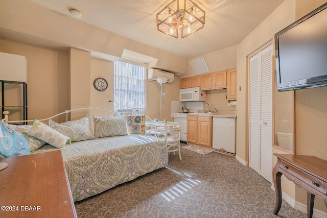 bedroom featuring an AC wall unit, a closet, sink, a chandelier, and dark colored carpet