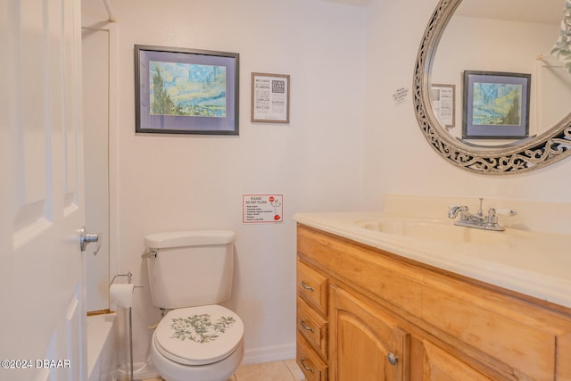 bathroom with vanity, tile patterned flooring, and toilet