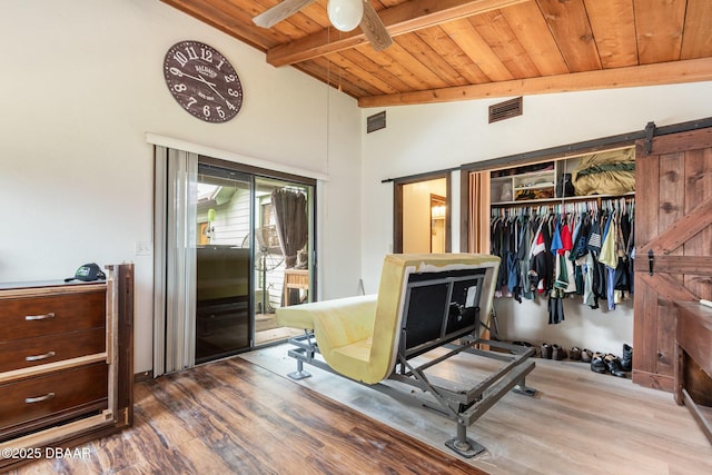 bedroom featuring wood ceiling, a closet, access to exterior, wood-type flooring, and lofted ceiling with beams