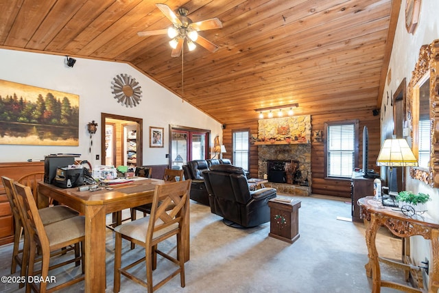 dining space featuring lofted ceiling, wood ceiling, light carpet, a fireplace, and ceiling fan