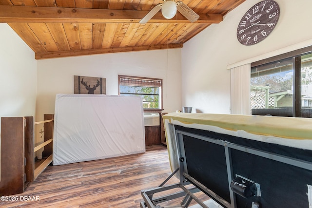 bedroom with hardwood / wood-style flooring, wood ceiling, and vaulted ceiling with beams