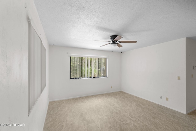 unfurnished room with a textured ceiling and ceiling fan