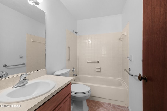 full bathroom with tiled shower / bath combo, vanity, tile patterned floors, and toilet