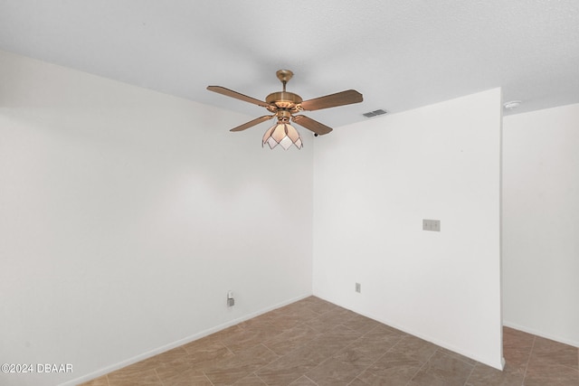 unfurnished room featuring ceiling fan