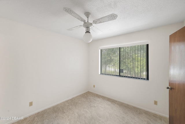 unfurnished room with a textured ceiling and ceiling fan