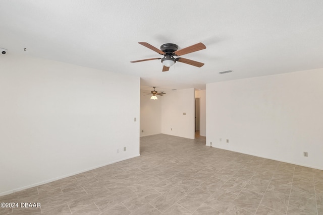 spare room with ceiling fan