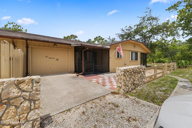 single story home featuring a garage