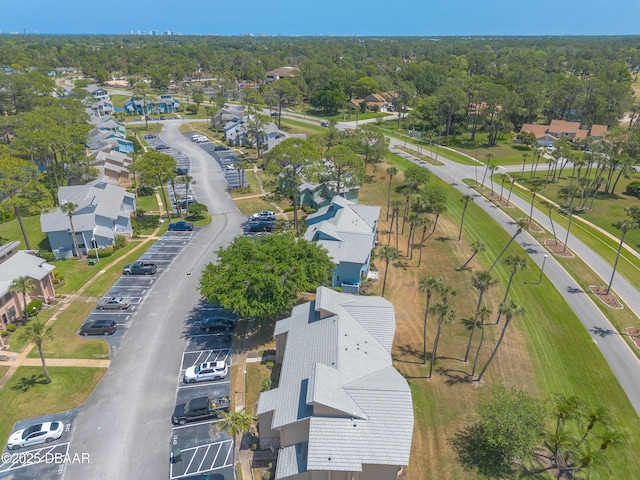 birds eye view of property with a residential view