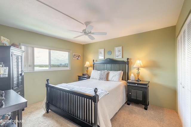 carpeted bedroom featuring a ceiling fan