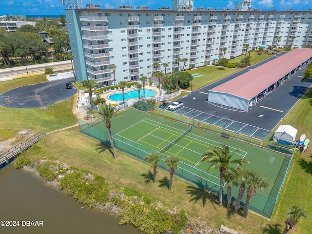 birds eye view of property with a water view