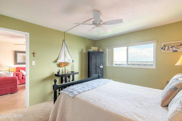 bedroom with tile patterned flooring and ceiling fan