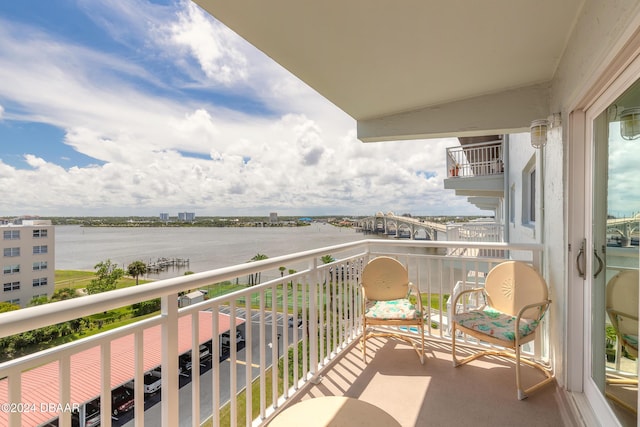 balcony featuring a water view