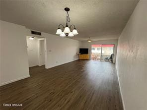 interior space featuring dark hardwood / wood-style flooring and a notable chandelier