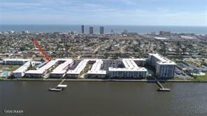 birds eye view of property with a water view