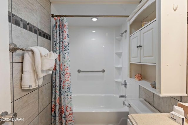 bathroom featuring vanity and shower / tub combo with curtain