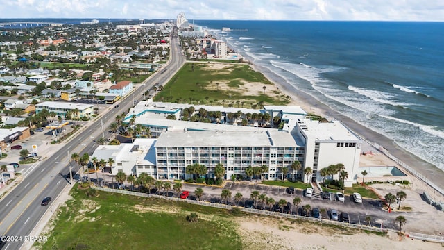 birds eye view of property with a beach view and a water view